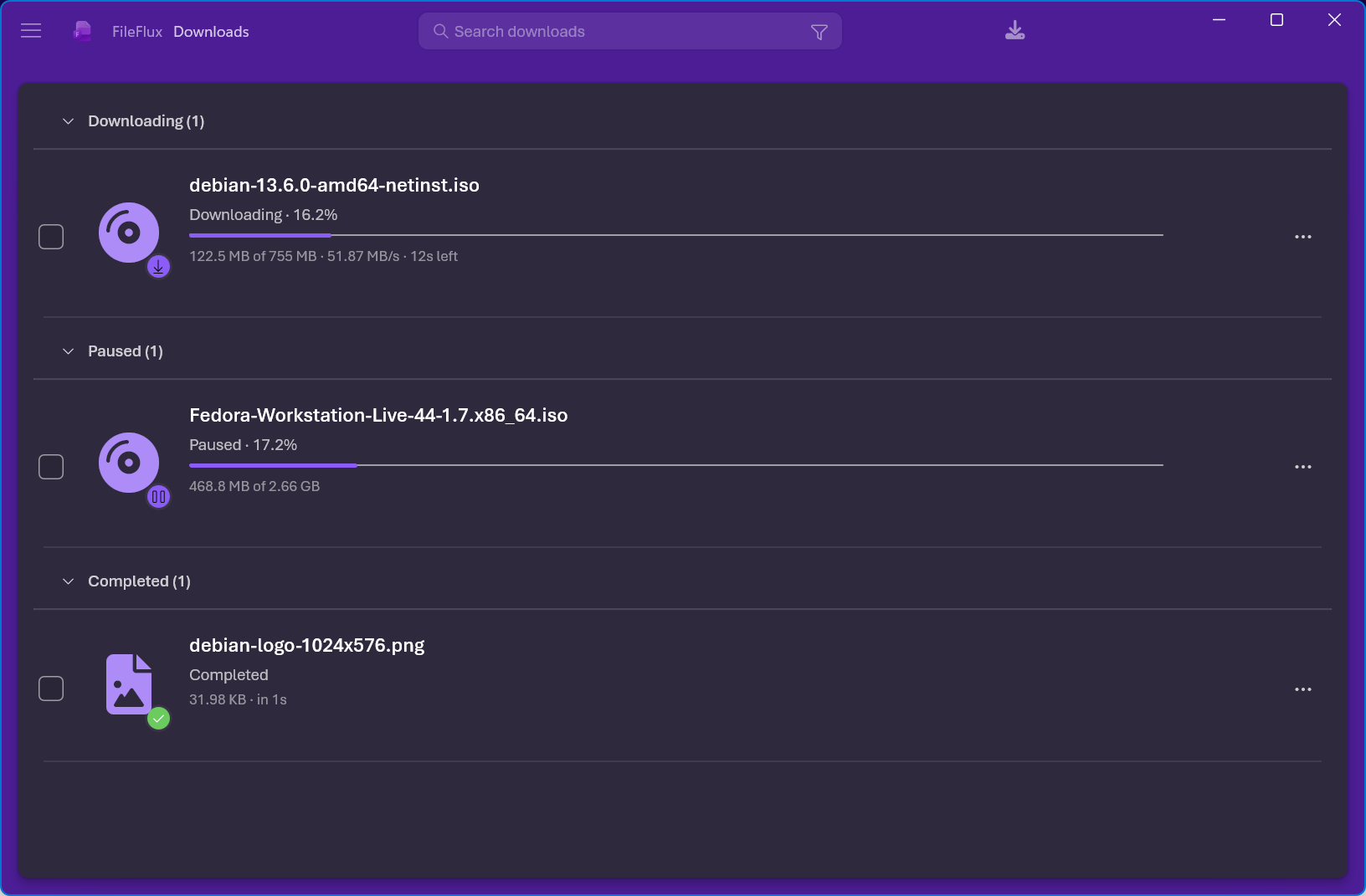 The FileFlux main window, with downloads grouped by status